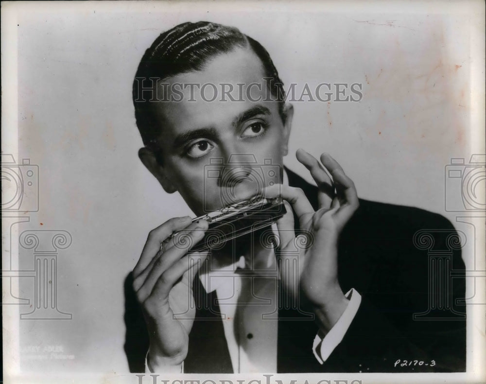 1948 Larry Adler playing the harmonica - Historic Images