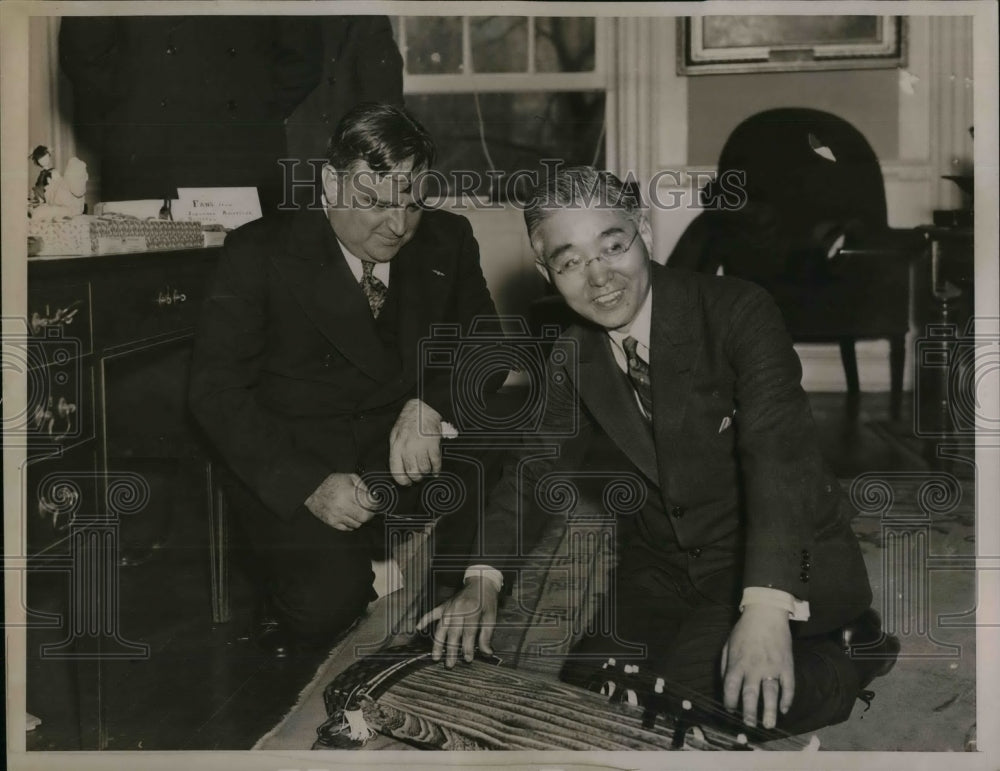 1935 Mayor LaGuardia watching Mr. Inomata playing a Japanese Koto - Historic Images