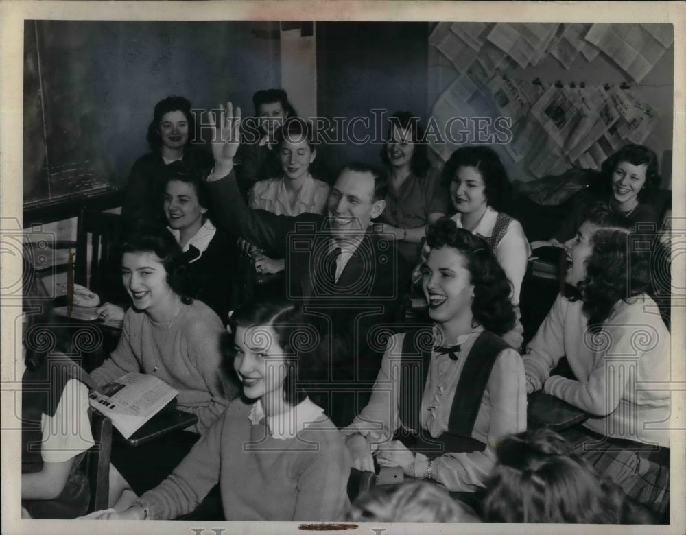 1944 Music Director Rolph Rush sits in Burton Leidner&#39;s Journalism - Historic Images
