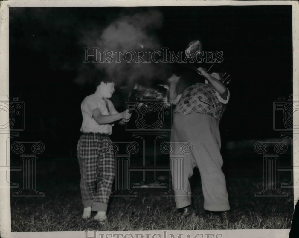 1940 Press Photo Circus Clowns With Fire In Yard - nea16563 - Historic Images