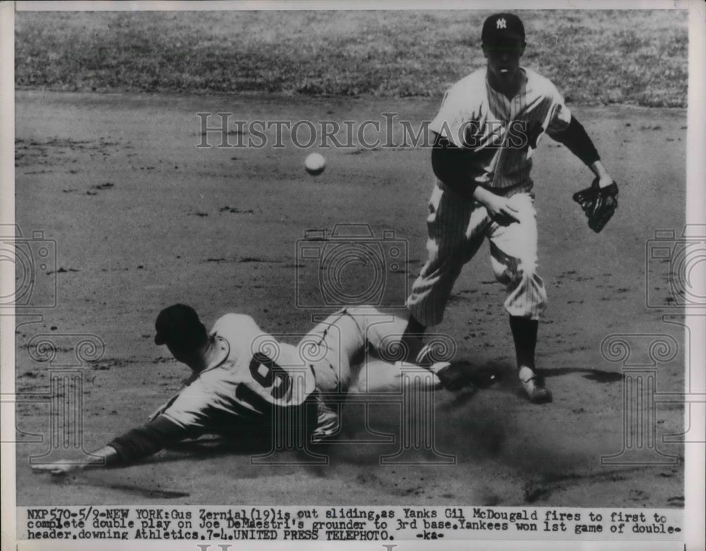 1954 Yankees Gus Zernial slides out and Gil McDougald.  - Historic Images