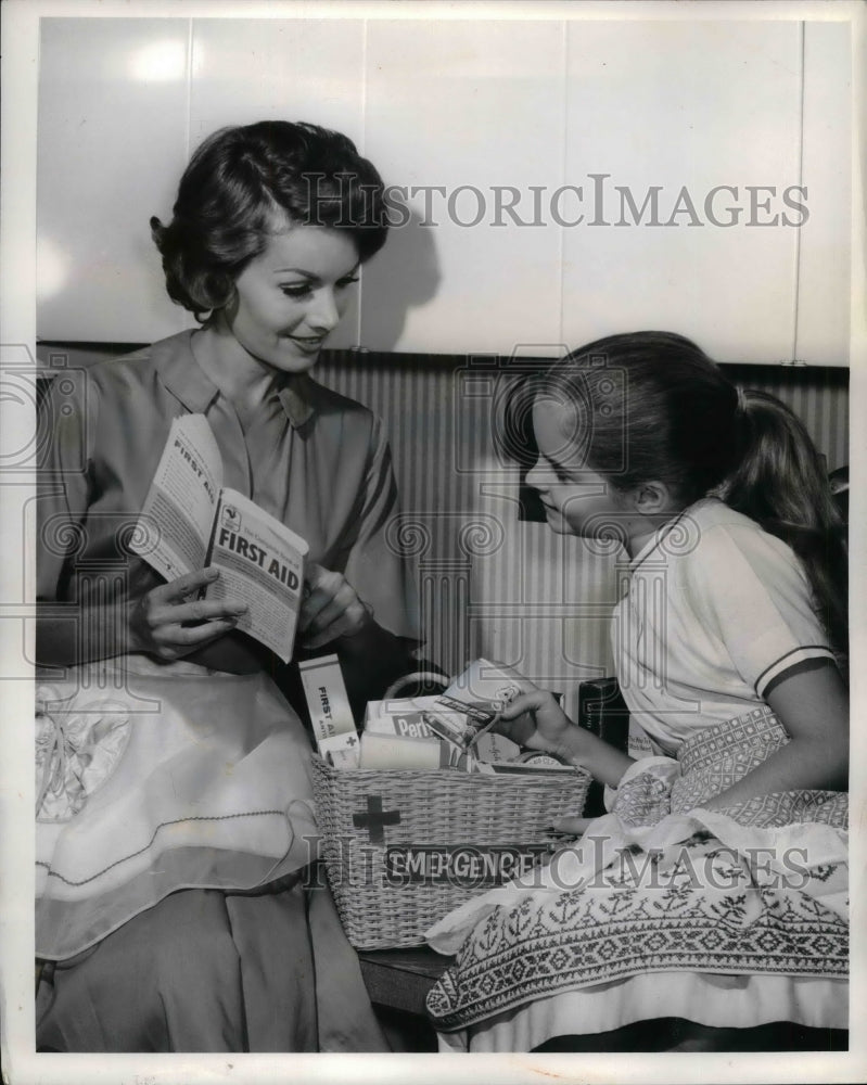 1961 Press Photo Daughter with Mother Teaching First Aid - nea19415 - Historic Images