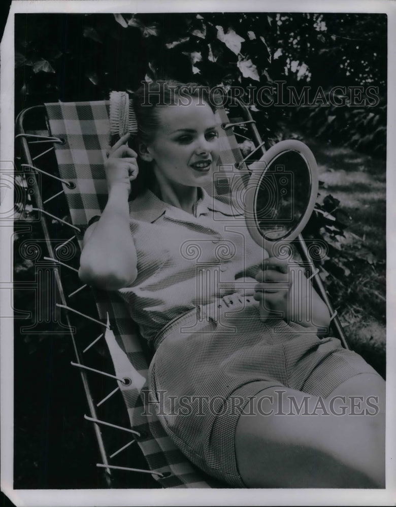 1955 Press Photo Woman Brushing Hair - nea19667-Historic Images