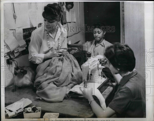 1958 Fontayne with her seamstress and her cat.  - Historic Images