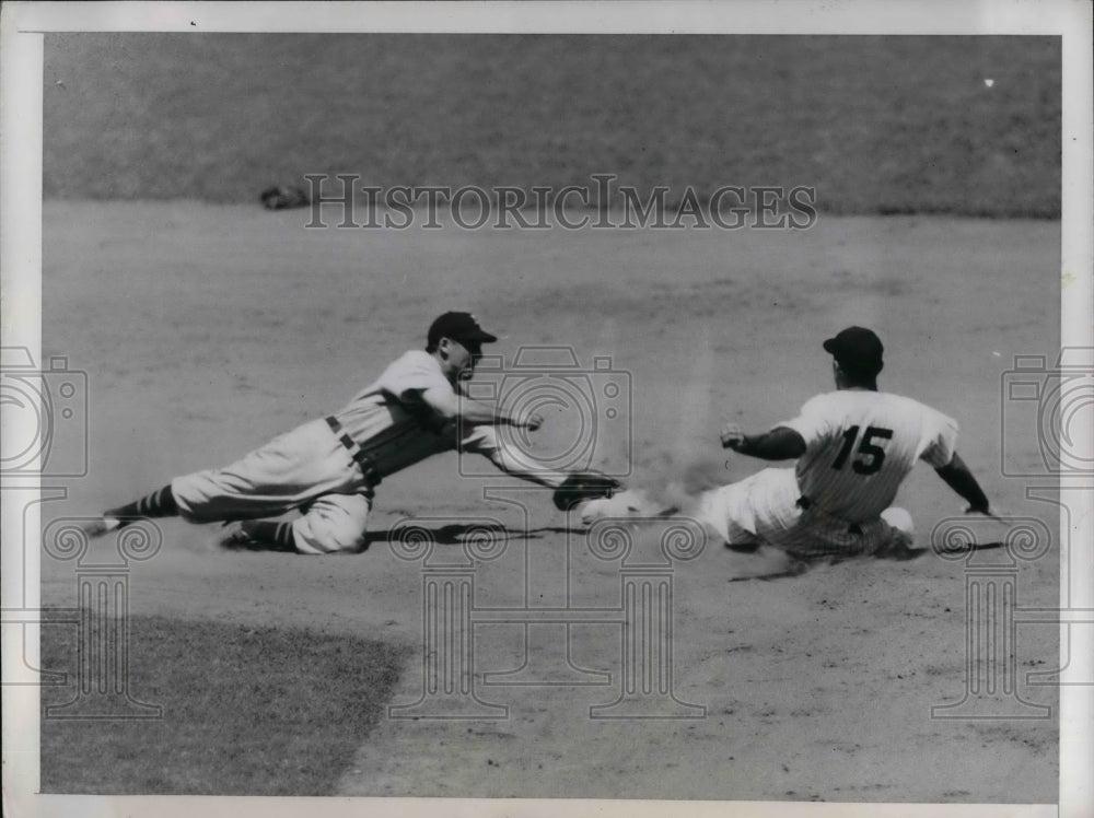 1947 Tommy Henrich of Yankees slides to steal Eddie Lake of Tigers. - Historic Images