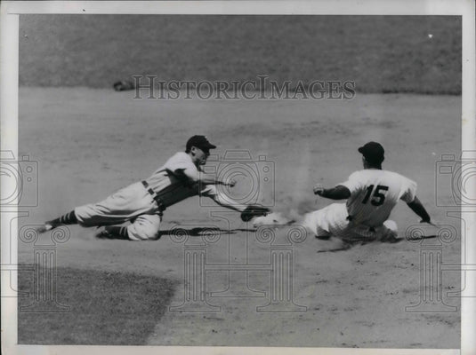 1947 Tommy Henrich of Yankees slides to steal Eddie Lake of Tigers. - Historic Images