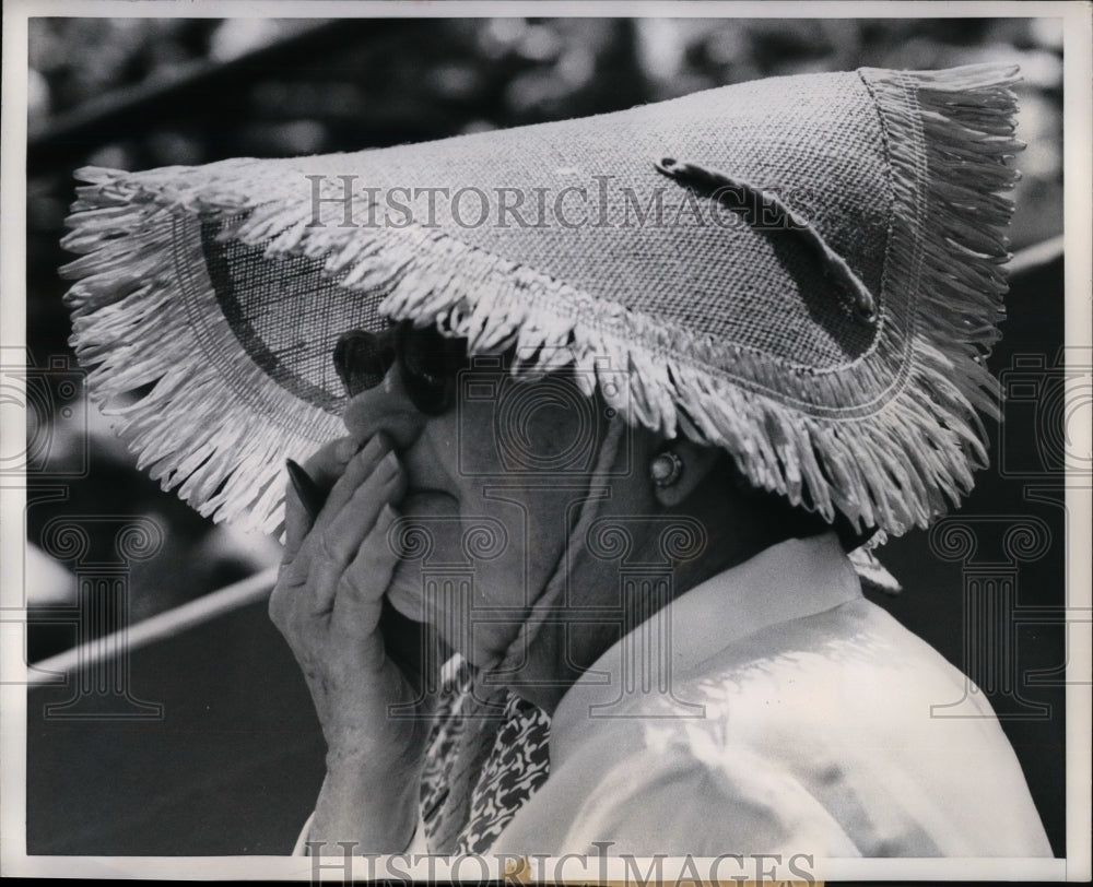 1958 Fan has her own awning at a baseball game - Historic Images