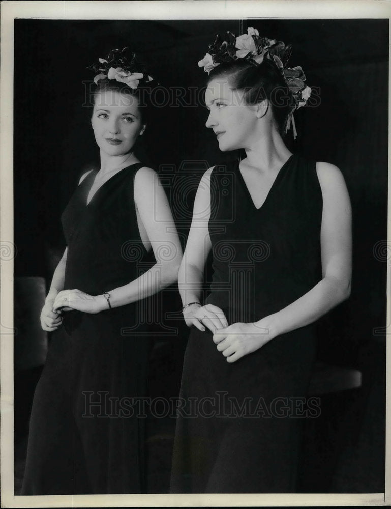 1937 Press Photo Crest of lotus flowers over a plum evening gown at the Fete Des - Historic Images