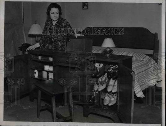 1935 Claire Dow showing off her combination bed & vanity w/ - Historic Images