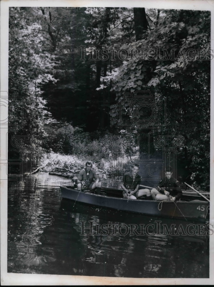 1968 Three explorer boy scout fishing in Boy scout reservation lake. - Historic Images