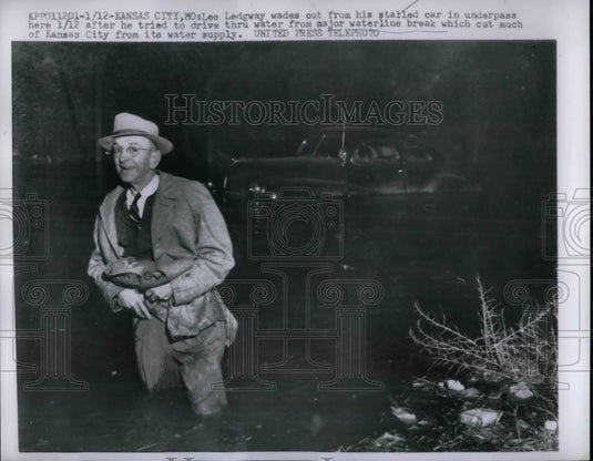 1957 Lee Ledgway after stalling car in water from waterline break - Historic Images