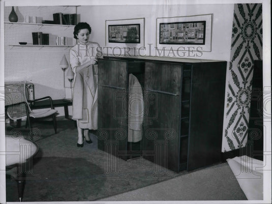 1957 Press Photo File for finery features shelves or hanger-rod pull-out - Historic Images