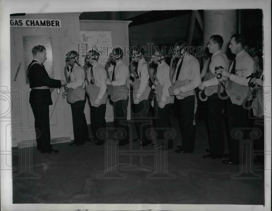 1941 Asst. Chief James Quinn, testing masks against tear gas - Historic Images
