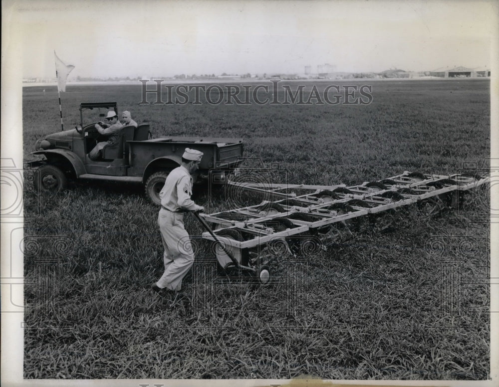 1943 Staff Sgt Norman Markwell Cutting Grass  - Historic Images