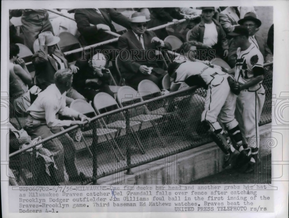 1956 Braves catcher Del Crandall falls over fence vs Dodgers - Historic Images