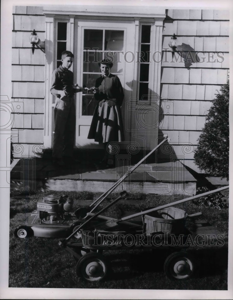 Press Photo Boy Shows His Mother New Lawn Mower - nea26174-Historic Images
