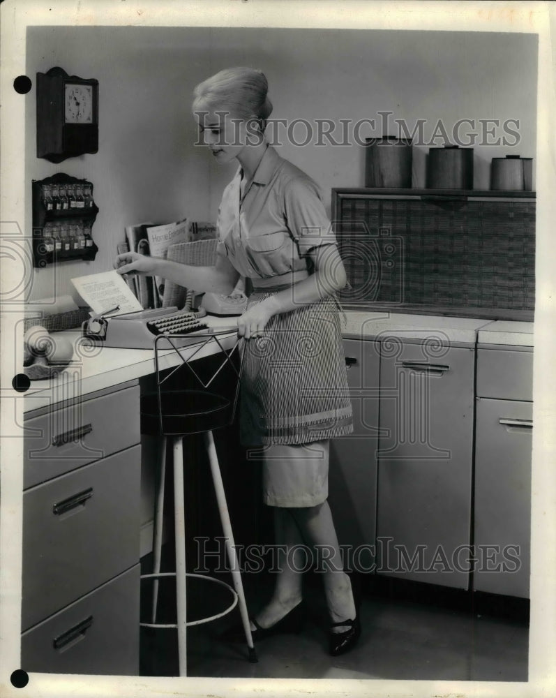 1963 A homemaker in her kitchen  - Historic Images