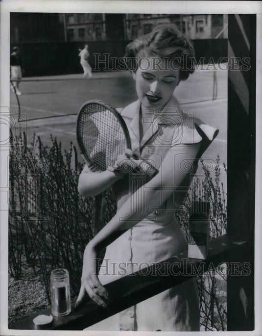1950 Press Photo Woman modeled a Cologne Sticks for quick freshup. - nea29617 - Historic Images