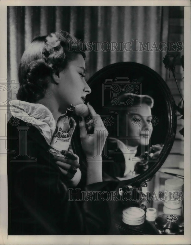 1948 Press Photo Woman modeled a perfume fragrance. - Historic Images