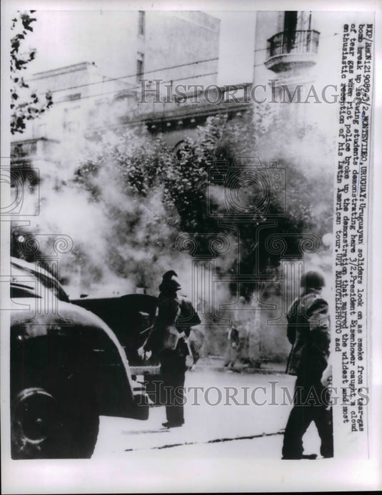 1960 Uruguayan soldiers look on as smoke from a tear - Historic Images