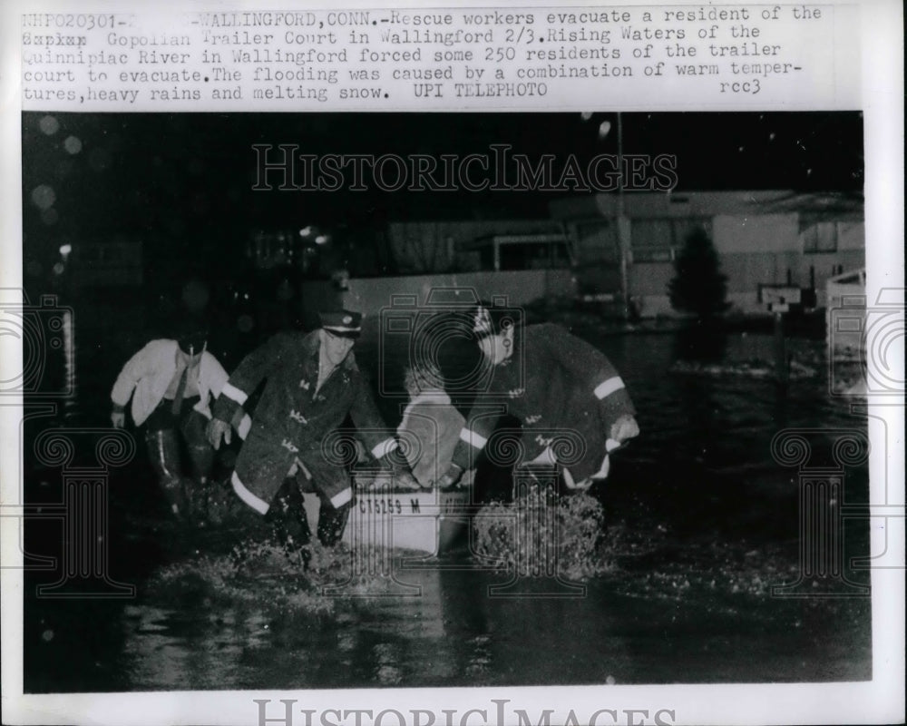 Rescuers evacuate of Wallingford, rising waters of Quinnipiac River - Historic Images