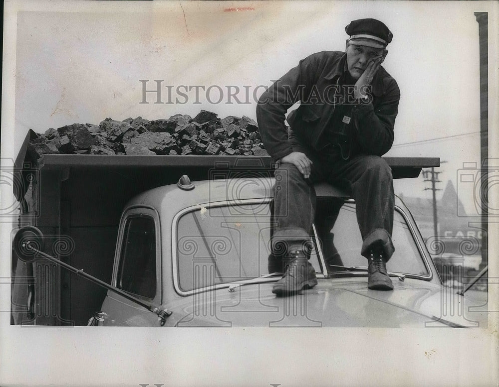 1950 man sitting atop a coal truck - Historic Images