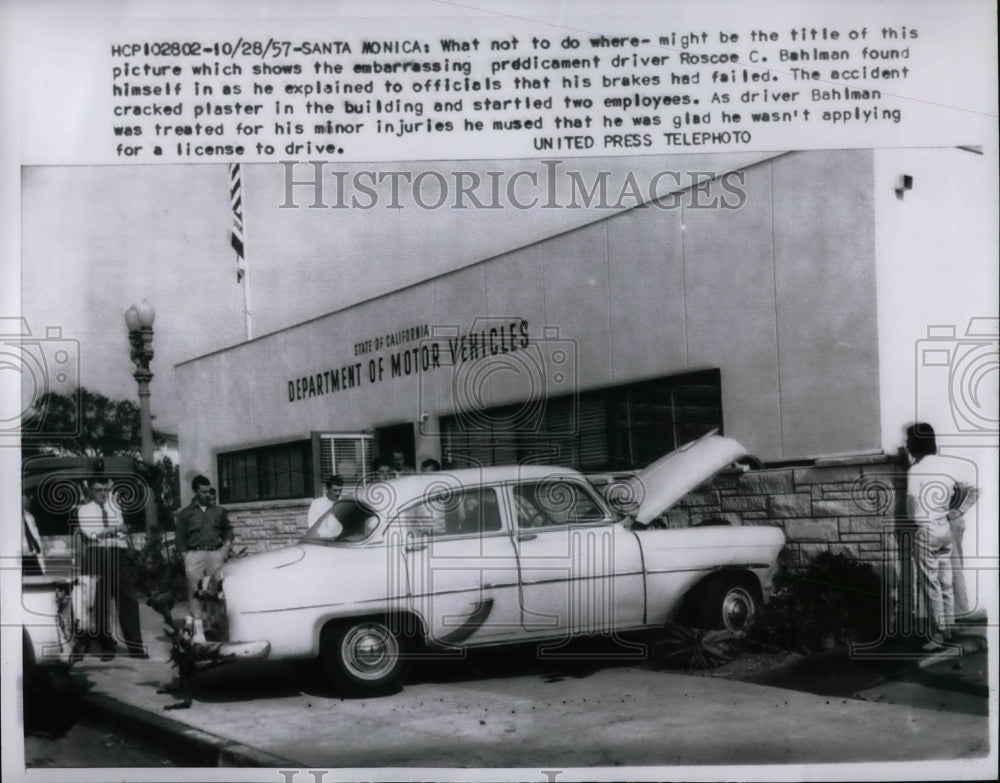 1957 Press Photo Roscoe C. Bahlman failed breaks at Dept. of Motor Vehicles - Historic Images
