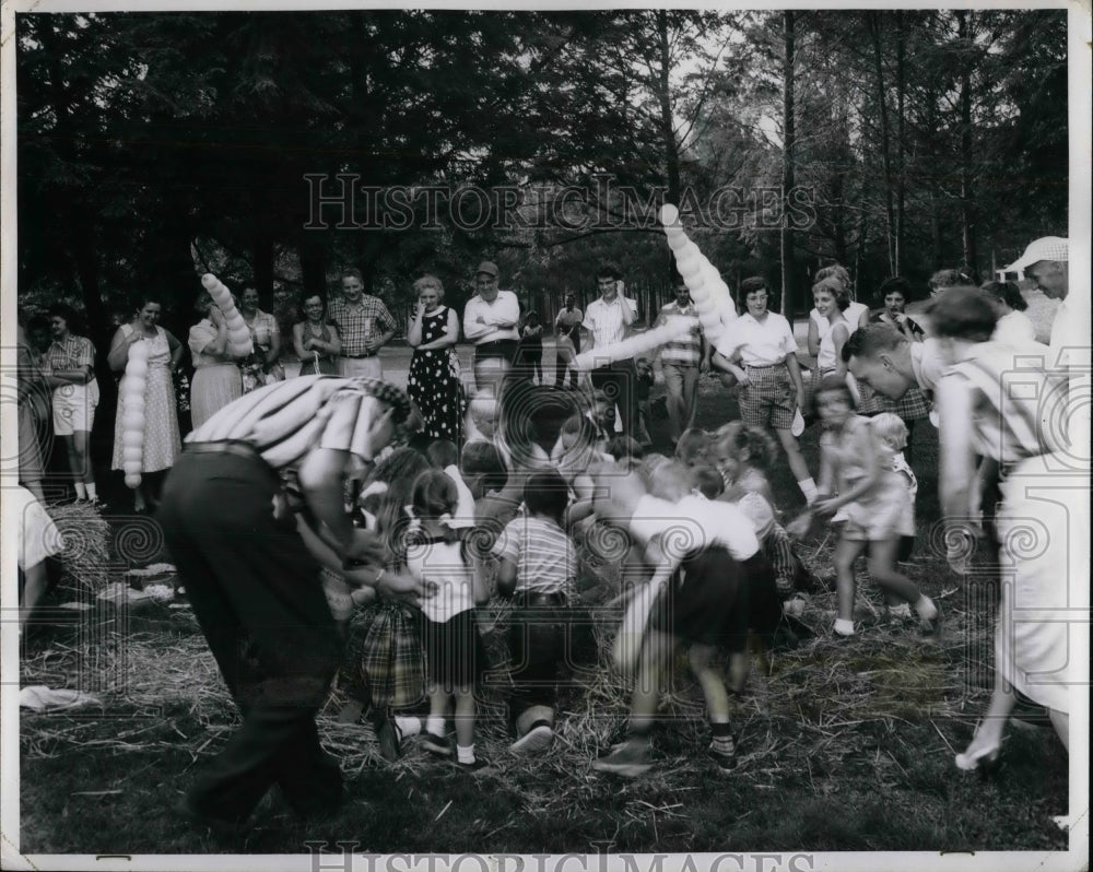 1964 &quot;Money Hunt in the Hay Pile&quot; is Popular with Kids at Event - Historic Images