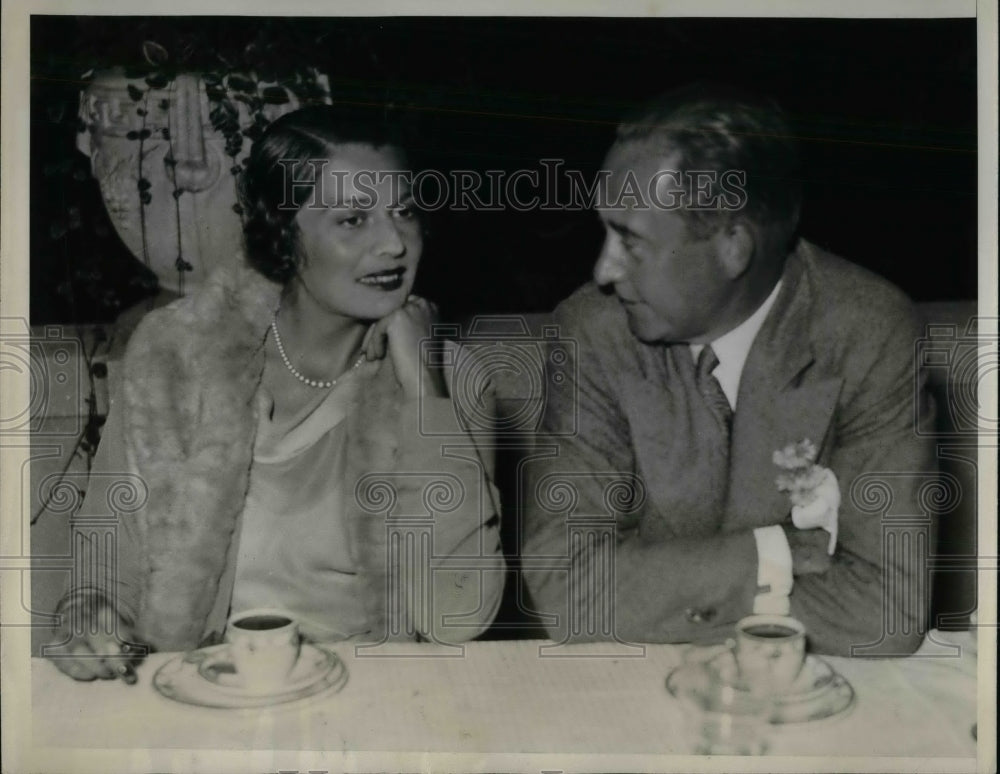 1933 Robert Kouk chats with Valerie Ziegler during the London Yacht - Historic Images