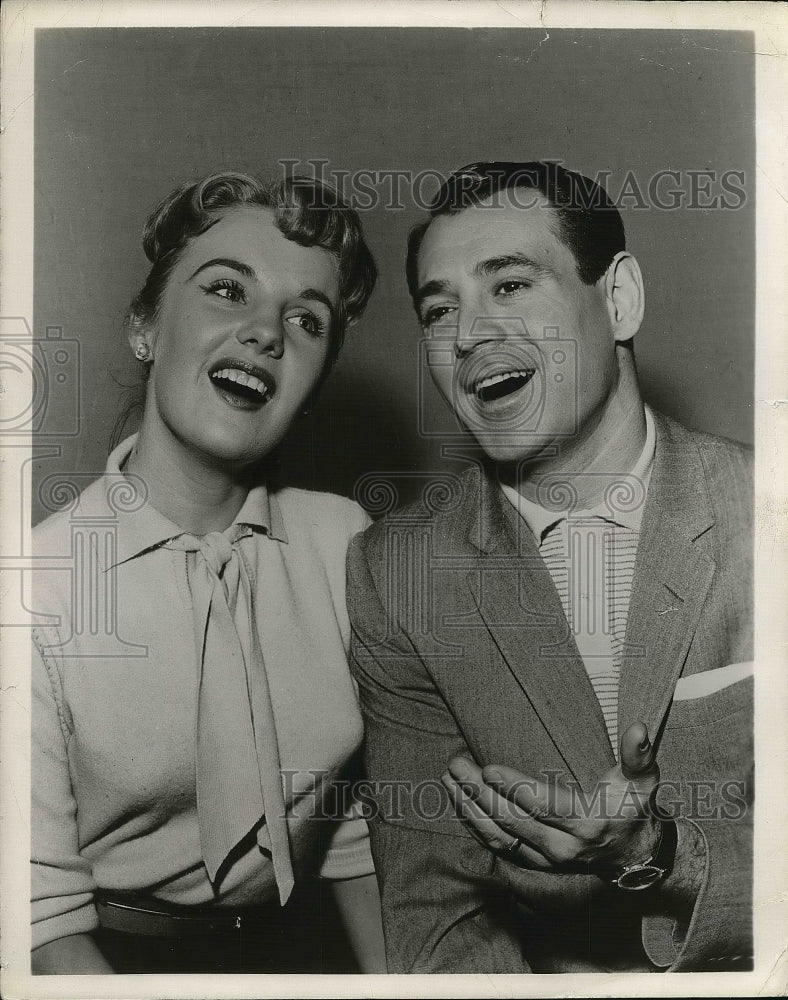 1957 Press Photo Young Lady and Young Man talking. - Historic Images