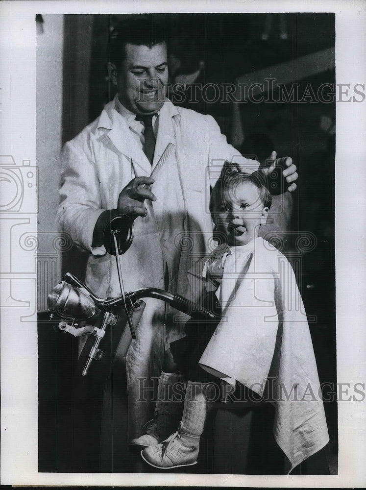 1959 Romanian Barber Gives Young Girl A Haircut  - Historic Images
