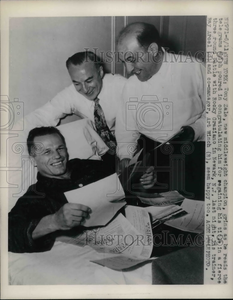 1948 Press Photo Middleweight Champion Boxer Tony Zale Reading Telegrams - Historic Images