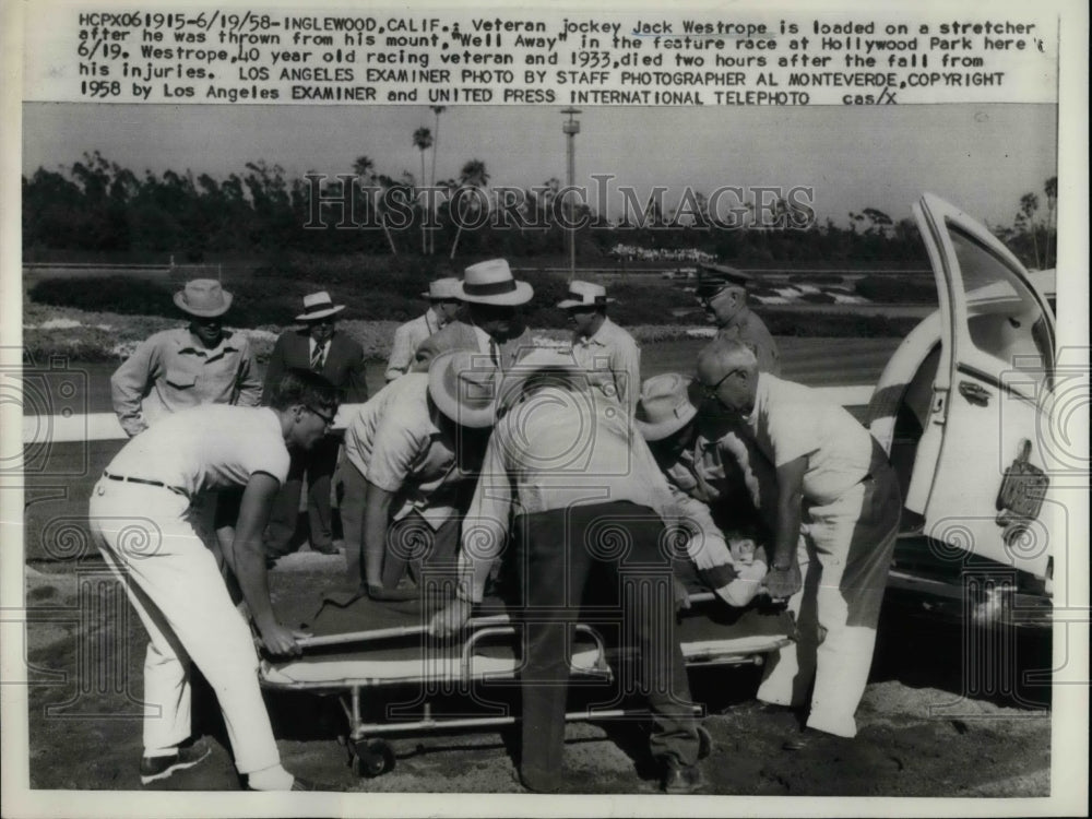 1958 Press Photo jockey Jack Westrope loaded onto ambulance, Hollywood Park-Historic Images