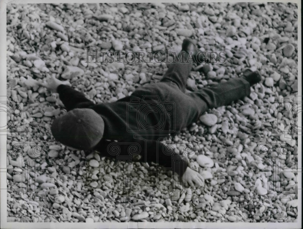 1961 A young boy on a pebble beach in Nice, France  - Historic Images
