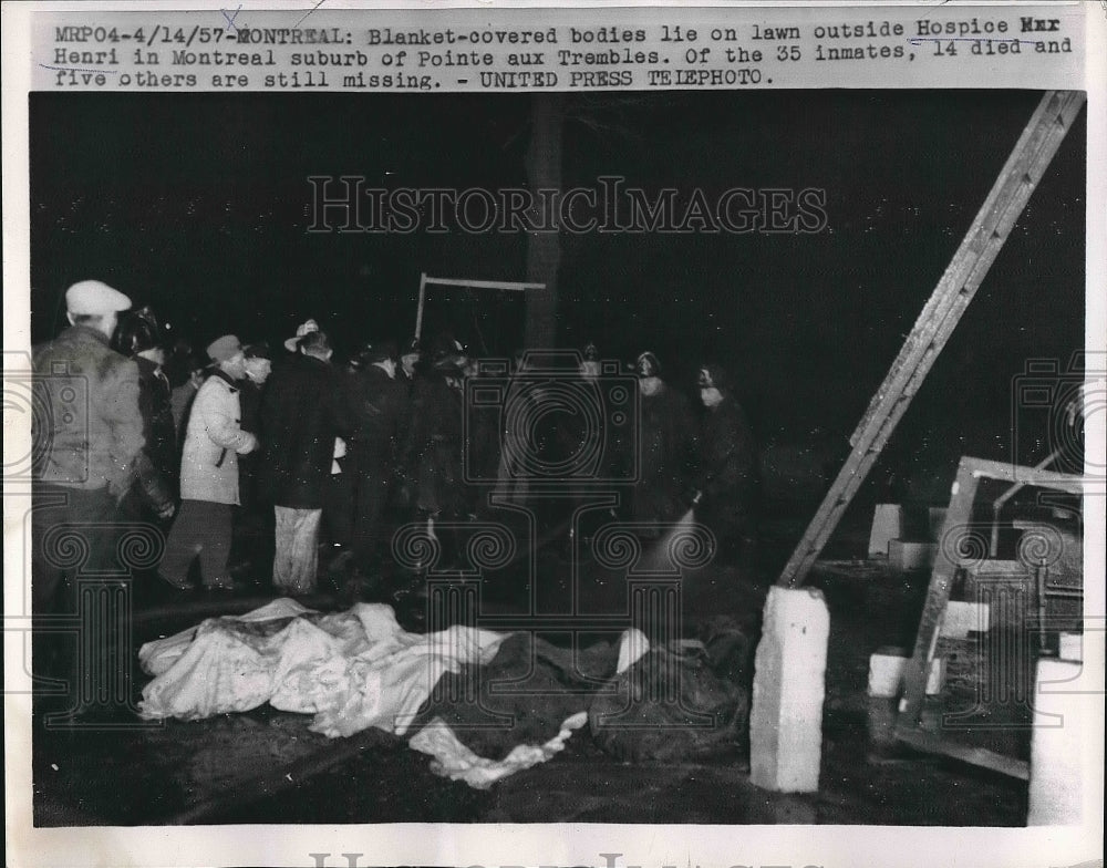 1957 Press Photo Blanket Covers Bodies Of Fire At Hospice Henri In Montreal - Historic Images