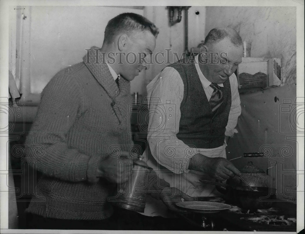 1933 Jim McLanier and John Foster in a kitchen - Historic Images