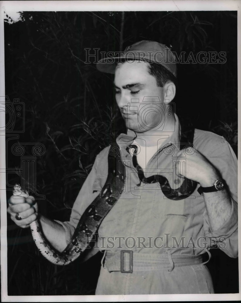 1956 Press Photo Capt William Hughes &amp; a snake in the Panama Canal zone - Historic Images