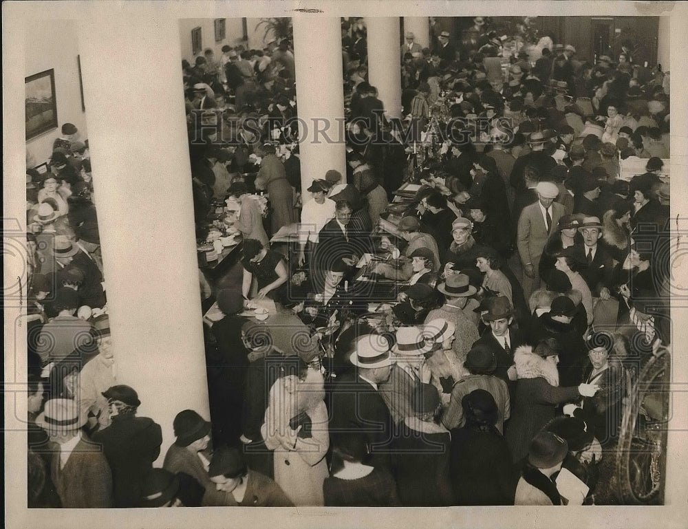 1934 Crowd at the store of White elephant Sale. - Historic Images