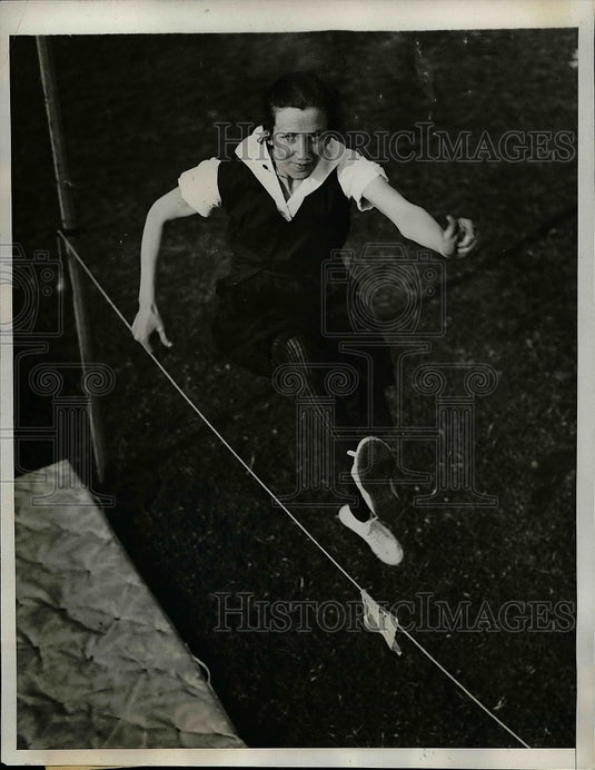 1934 Blanid Mulcahy at High Jump Event at the Annual Field Day - Historic Images