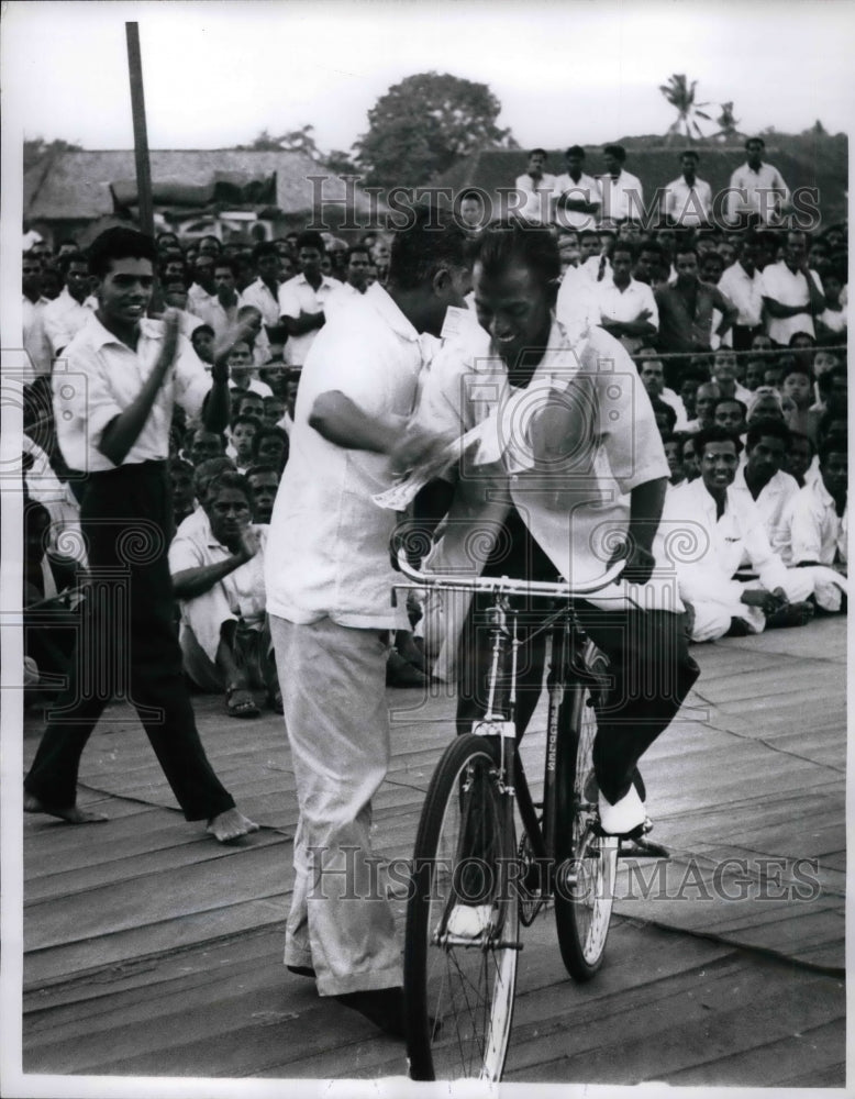 1961 The aftermath of Muthukumarah&#39;s attempt to bike for 80 hours. - Historic Images