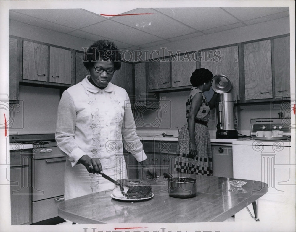 1969 Mrs Cola Wright & Mrs Thelma Jackson in a kitchen  - Historic Images