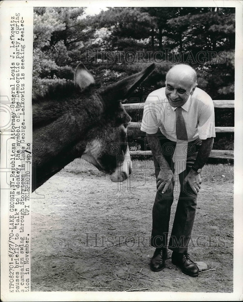 1970 Attorney General Louis Lefkowitz talking to a donkey - Historic Images
