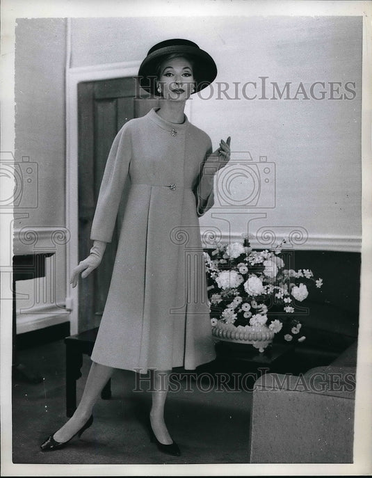 1958 Model showing off sky blue coat  - Historic Images