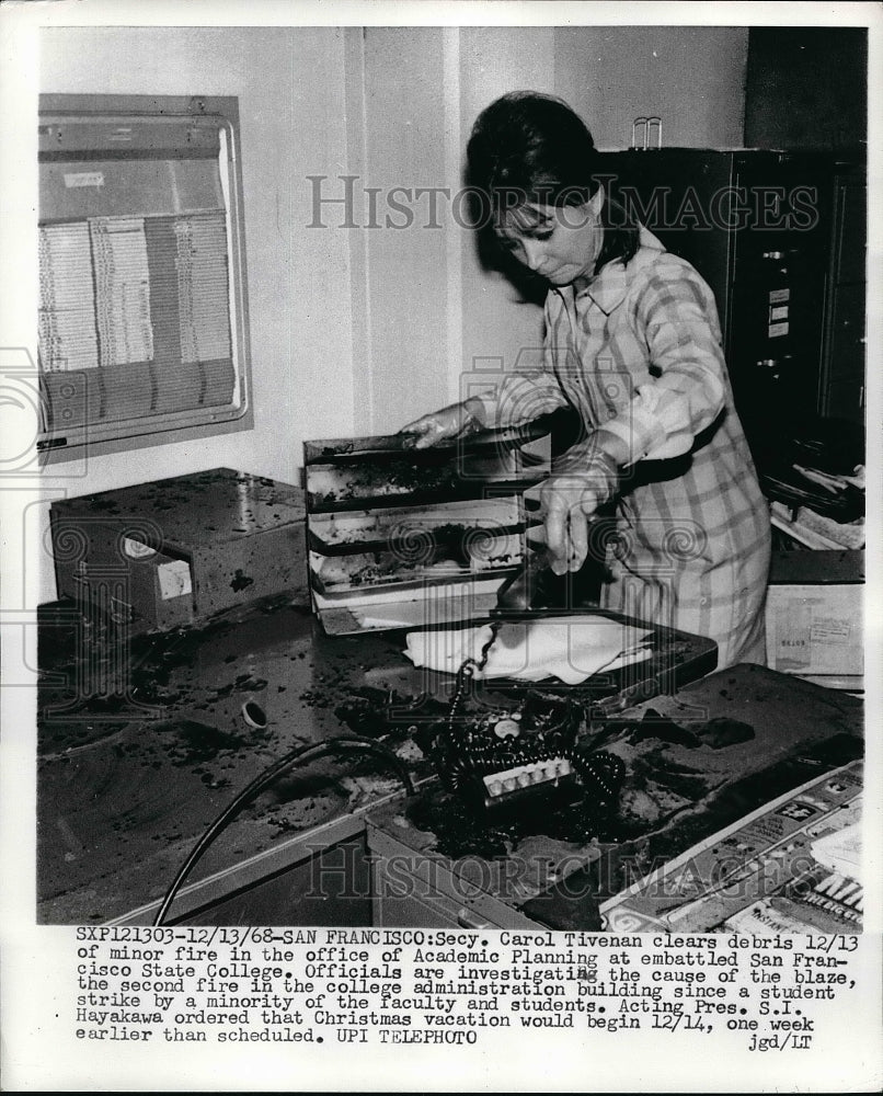 1968 Press Photo Secretary Carol Tivenan Cleans Up After Office Fire - nea50871 - Historic Images