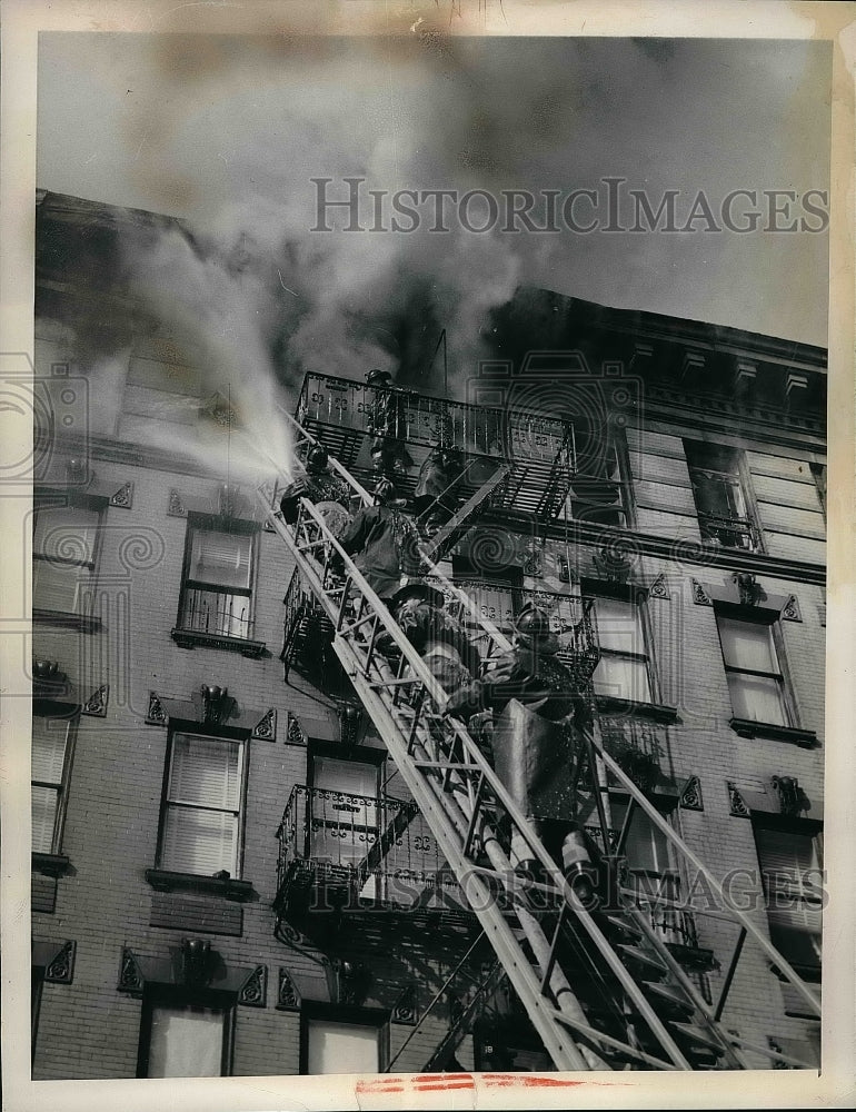 1955 Firemen Fight Blaze On Top Floor Of Apartment In Freezing Temps - Historic Images