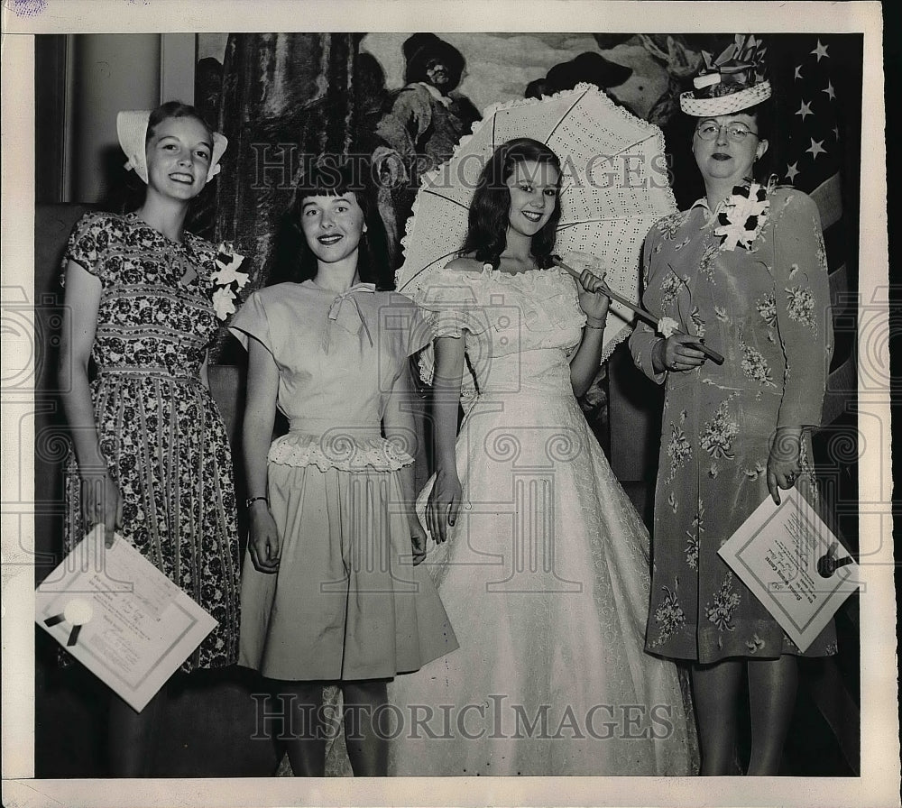 1945 Two winners at the annual sewing contest with their models. - Historic Images