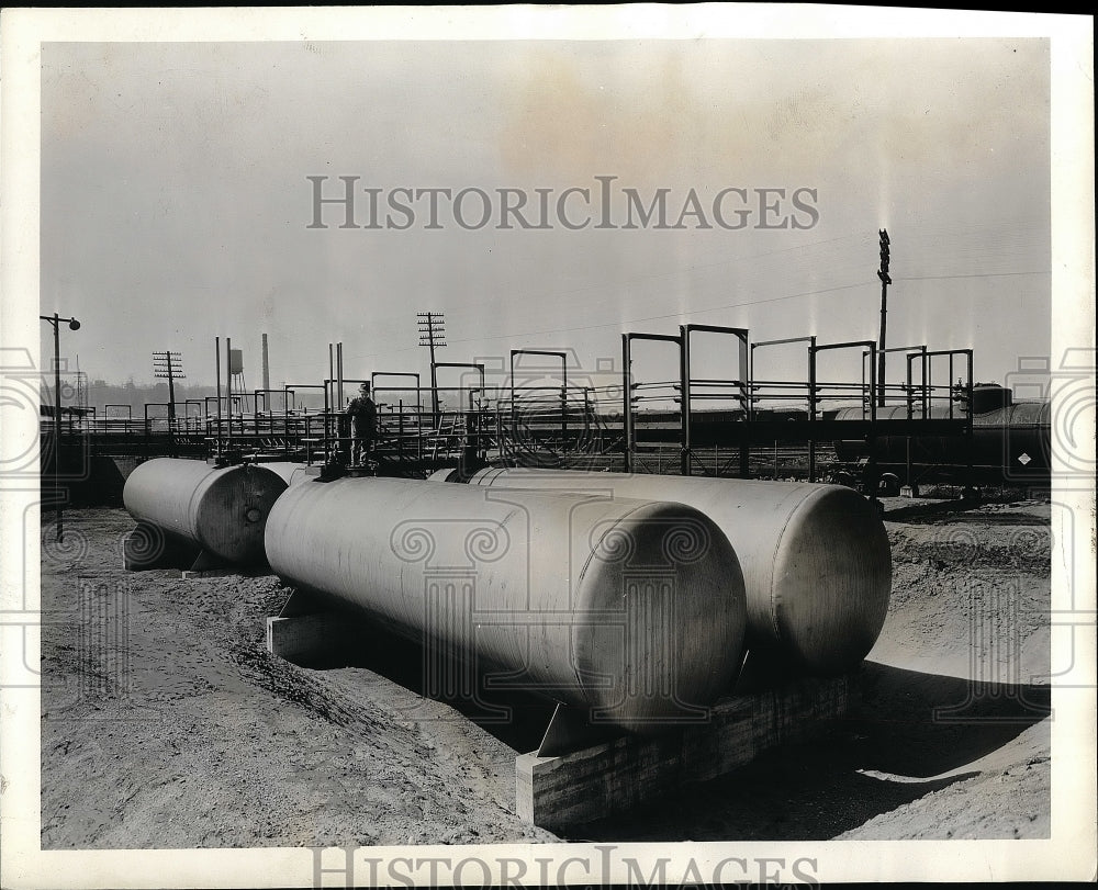 1941 Butadine storage tanks and tank car for BF Goodrich Company - Historic Images