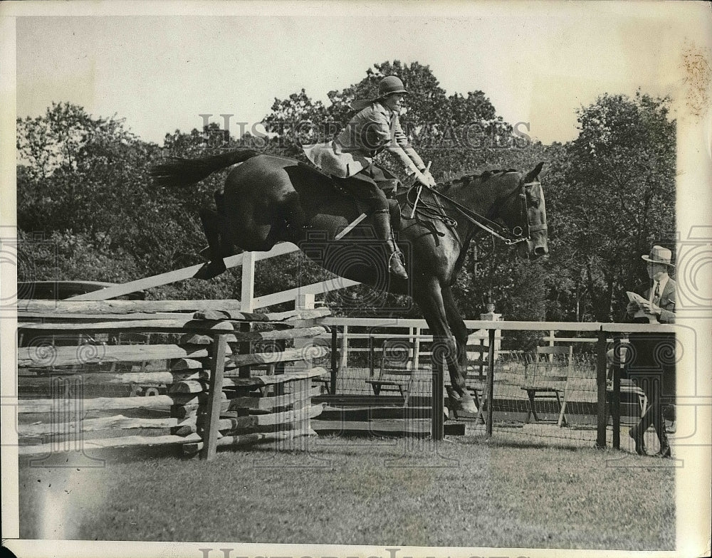 1931 Press Photo A rider jumping a fence in a horseshow - nea51776 - Historic Images