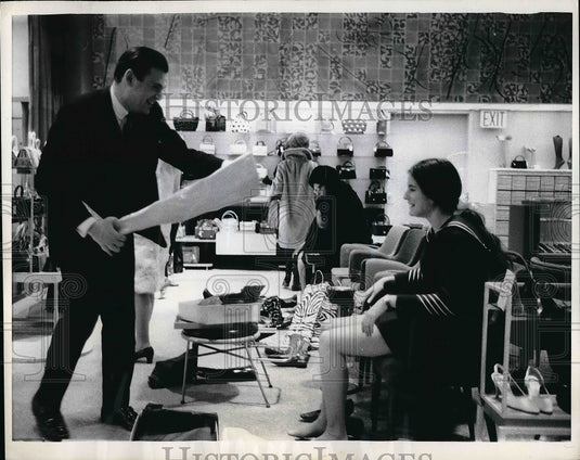 1968 Salesman Leonard Sapoff Shows Randi Kamine Boots  - Historic Images
