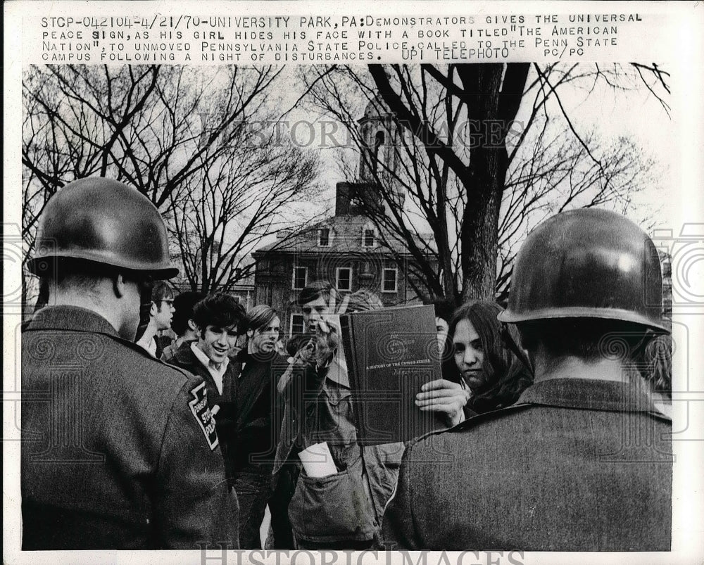 1970 Police confronting demonstrators in park  - Historic Images